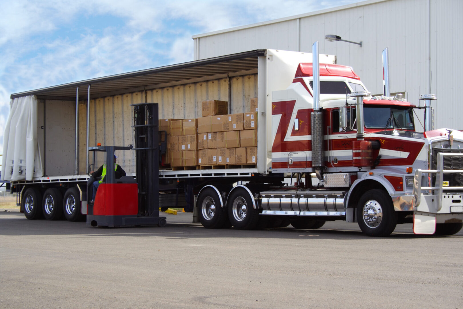 Forklift driver loading truck